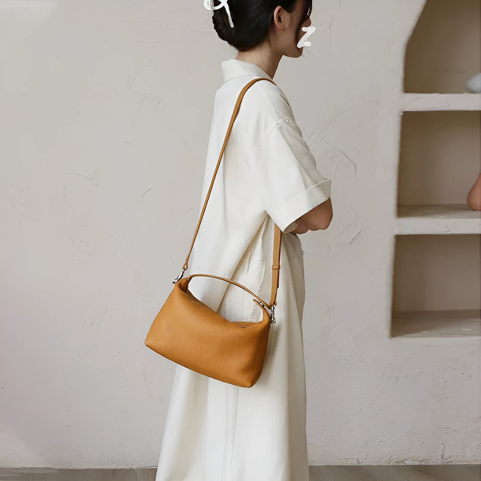 Genuine leather brown one shoulder lunch box bag with zipper closure and multiple internal pockets on white background