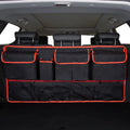 Black car boot hanging storage bag with red piping trim made from waterproof Oxford cloth with handle
