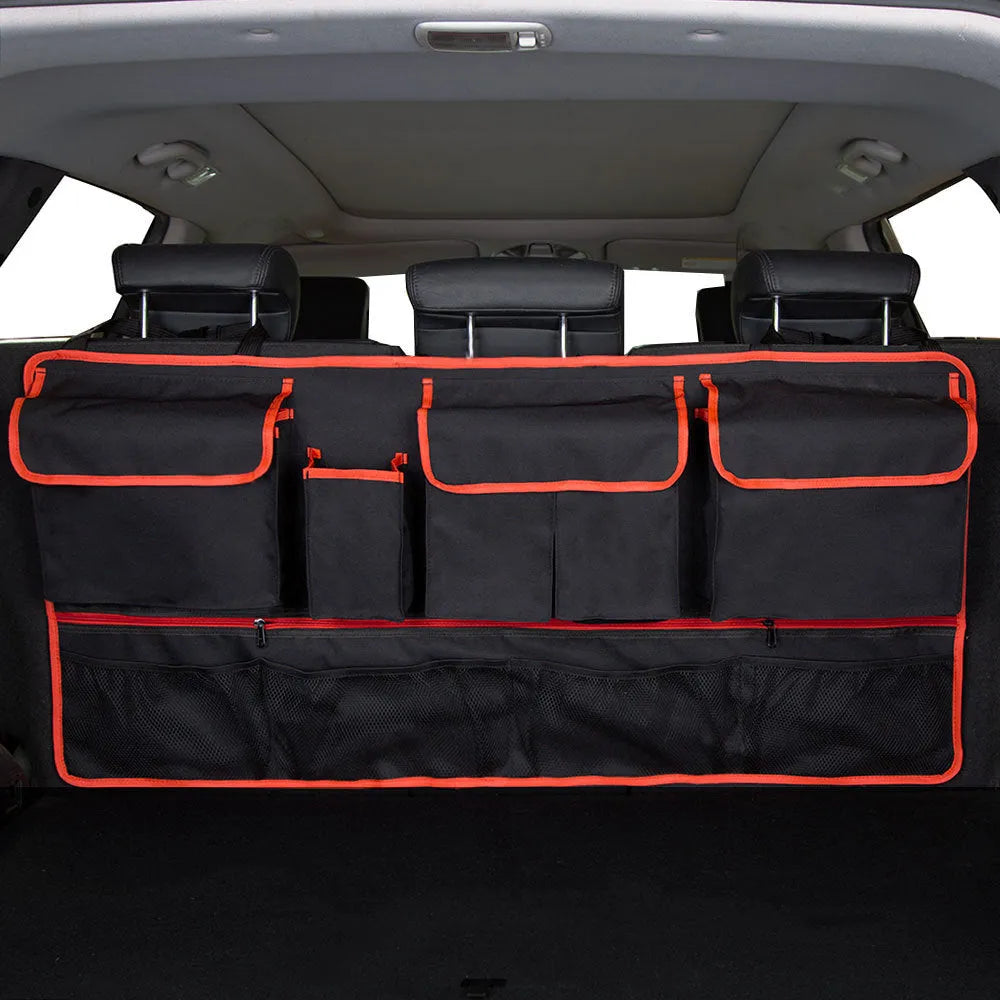 Black car boot hanging storage bag with red piping trim made from waterproof Oxford cloth with handle