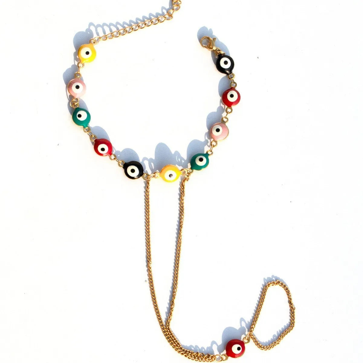 Women's titanium steel round eyes lucky mitten-type bracelet in colourful electroplated finish on a neutral background