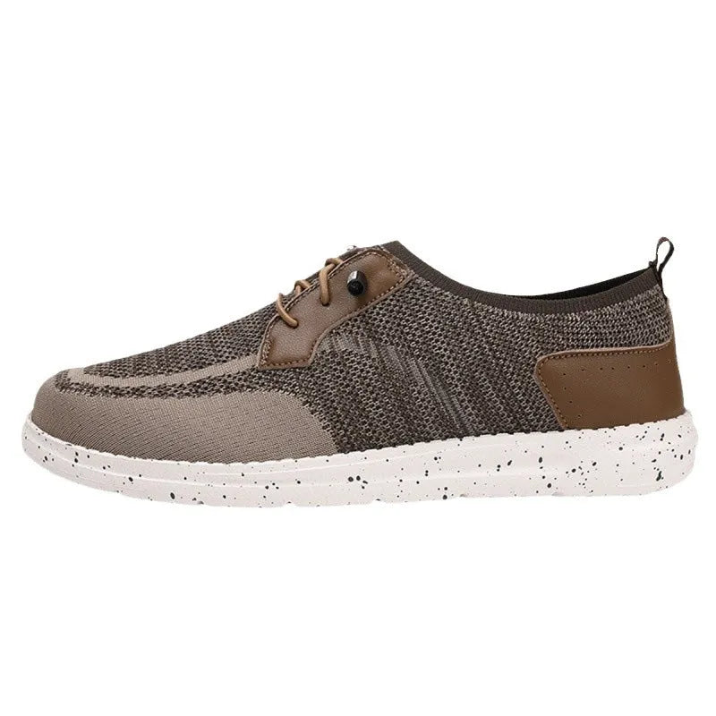 Men's black laceless canvas slip-on casual shoes with a round toe and rubber sole.