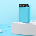 Compact mini power bank portable charger in various colours showing size and USB ports.