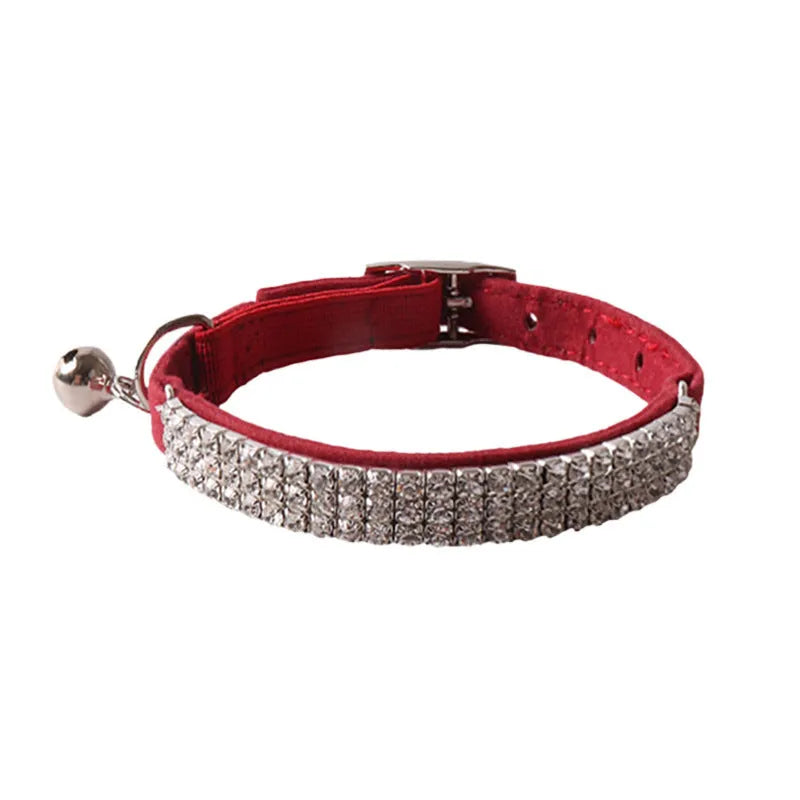 Soft flocking cat collar with elastic buckle and metal gang drill in assorted colours.