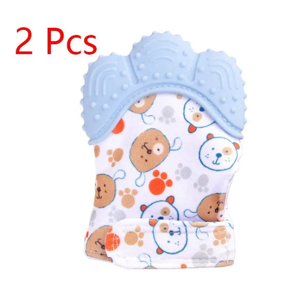 BPA-free silicone baby teether glove fastened with a white Velcro strap on a baby's hand