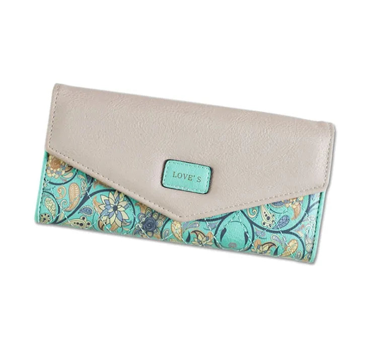 Women's black three-fold PU leather wallet with a buckle closure, shown open to display multiple card slots.