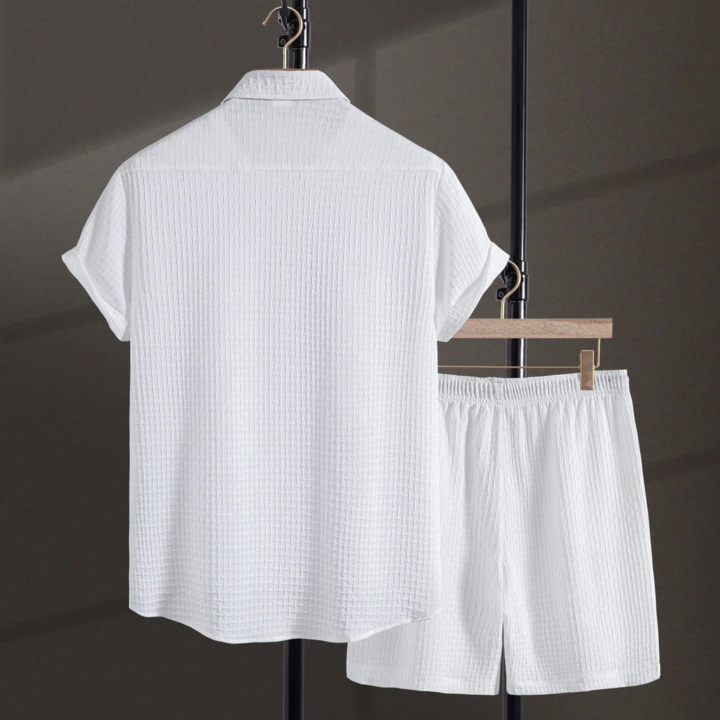 Men's white cotton blend beach shorts suit with short sleeve shirt on a hanger.