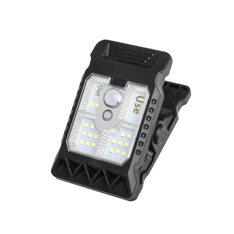 White ABS plastic motion sensor clip lamp with LED light, shown attached to a cupboard door edge.