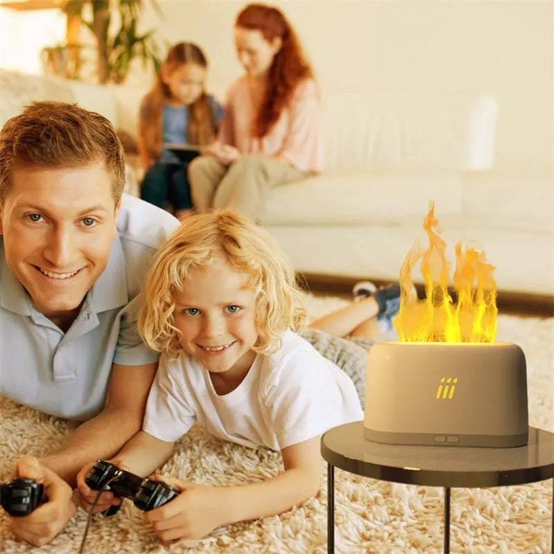 Black round ultrasonic aroma diffuser and humidifier with LED lights and remote control on a table.