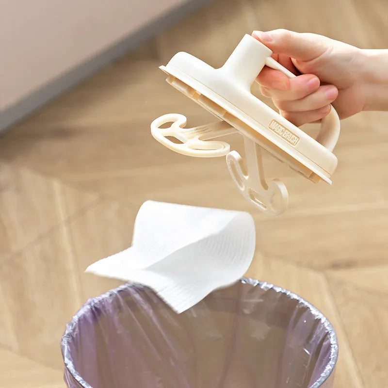 Disposable Magic Cleaning Brush with plastic handle and a pack of 50 white non-woven replacement rags.