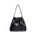 Genuine leather women's bucket bag with one shoulder strap in a retro style.
