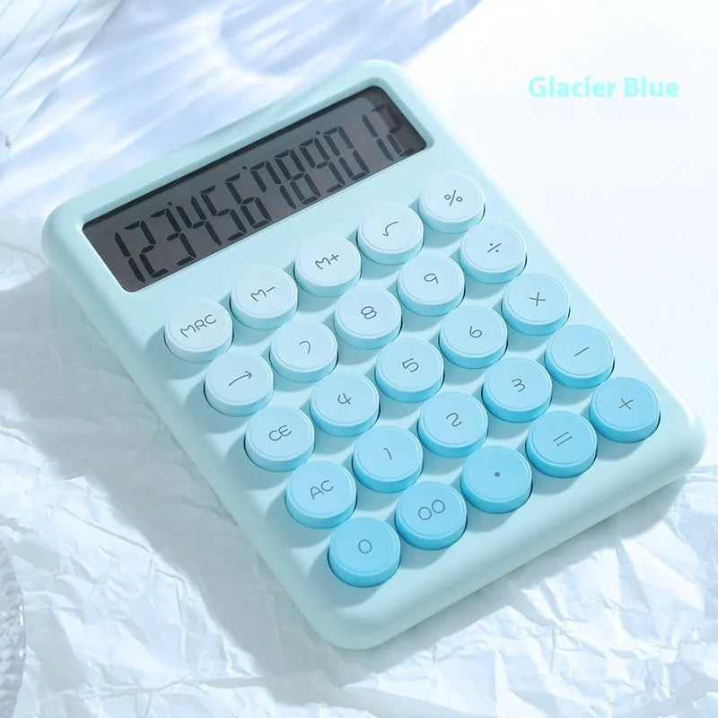 Desktop calculator with gradient colour finish in violet, cherry blossom pink, glacier blue, or mint green on a desk.