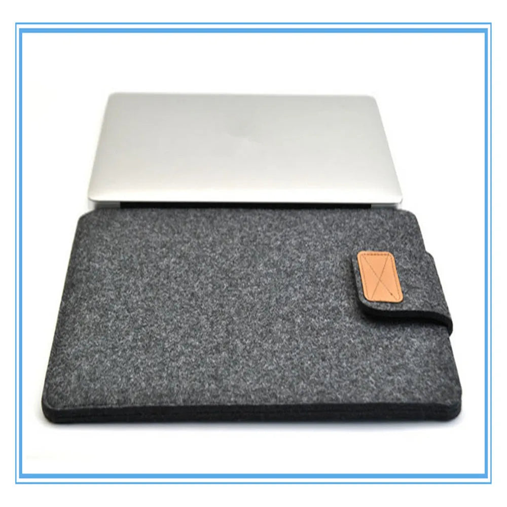 Vertical clamshell laptop bag in grey with plush felt interior and waterproof polyester exterior