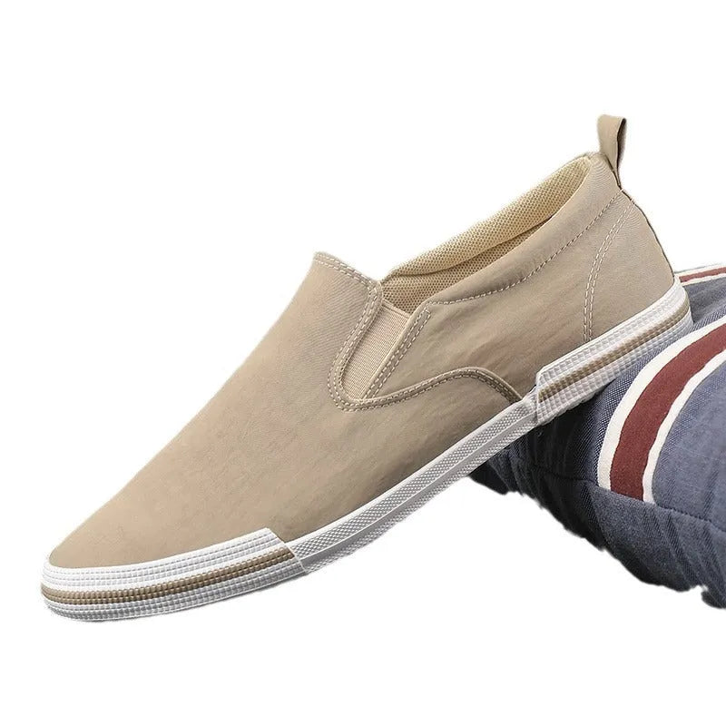 Men's low-top canvas sneakers in grey, black orange, or khaki with a vulcanised rubber sole.