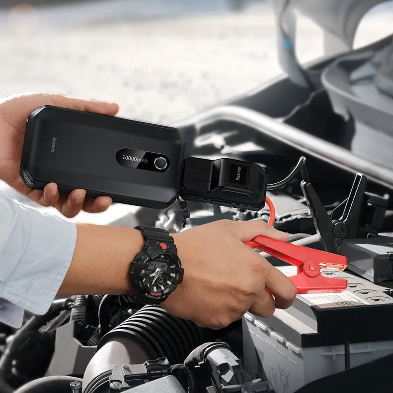 Black vehicle mounted emergency lighter jump starter with 10000mAh capacity and USB output