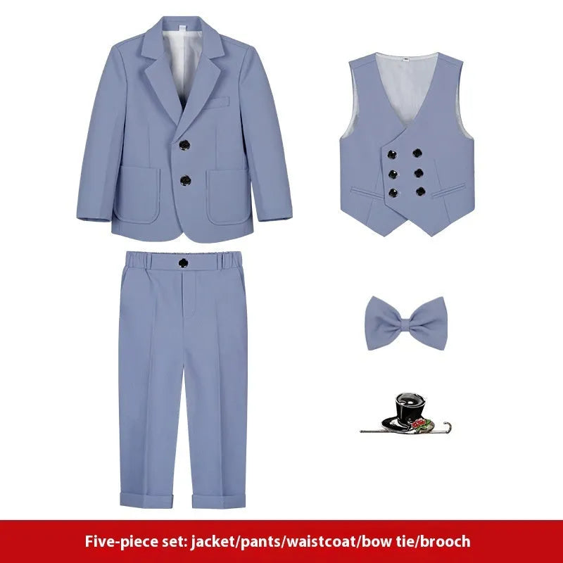 Boy's solid colour British style suit dress set with coat, trousers, vest, bow tie, and brooch on a hanger