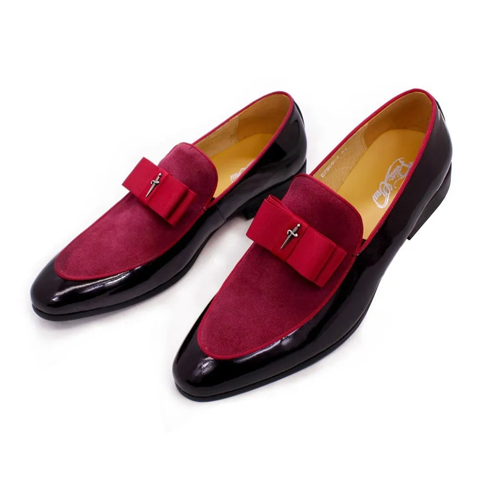 Men's glossy black patent leather low-top shoes with a tassel on a leather toe holder.