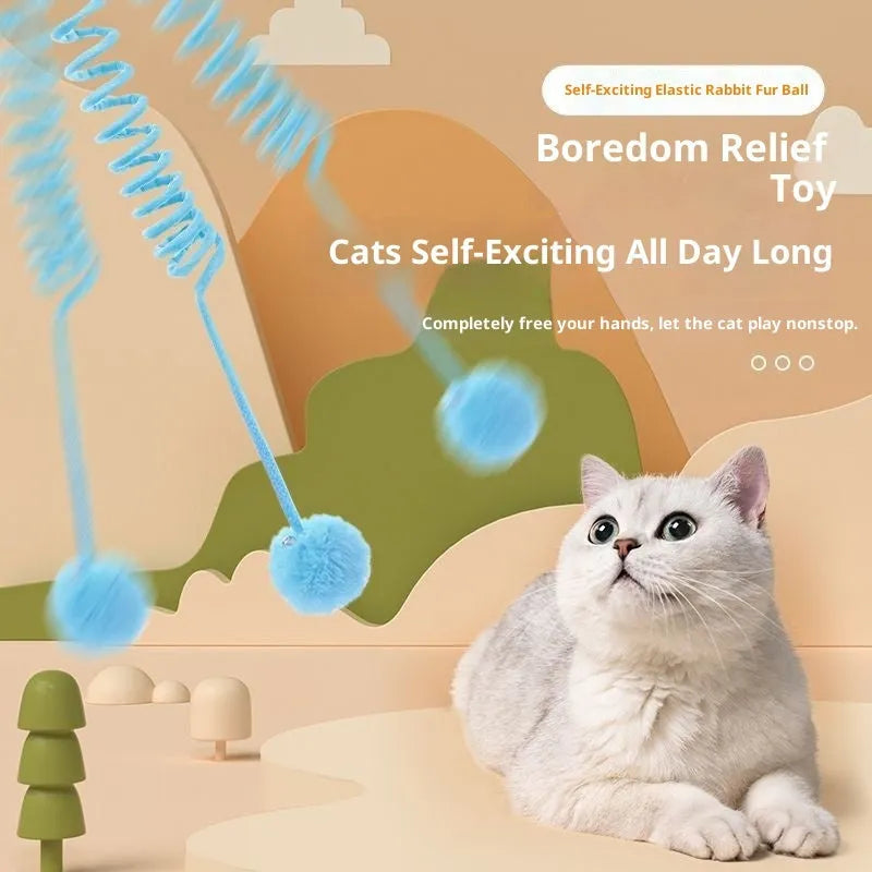 Cat toy with suction cup, spring, rabbit fur ball, and retractable elastic rope on a door