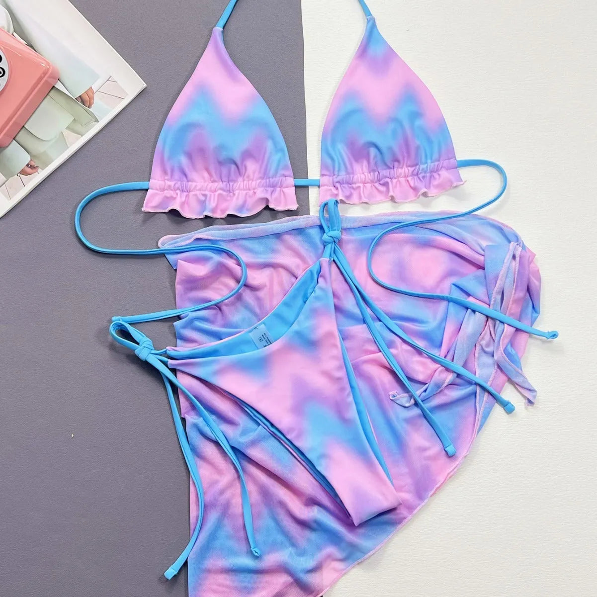 Women's split tie-dye swimsuit bikini set showing bra, skirt and panties