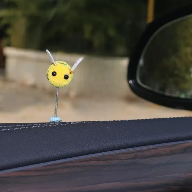 Swing Spring Bee car decoration with fur ball material and cartoon design measuring 3x3 cm