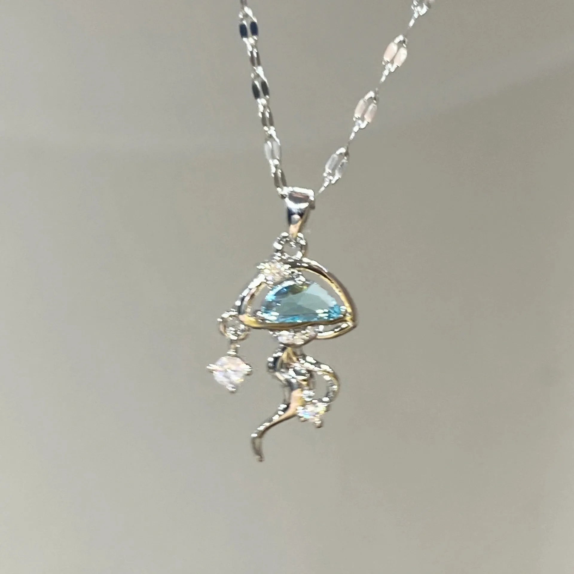 Sterling silver blue jellyfish necklace with white gold finish on adjustable chain
