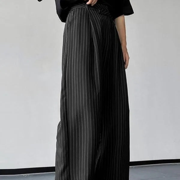 Men's black vertical striped pleated casual trousers showing elastic fabric and Asian sizing options