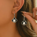 A pair of silver retro-style creative alloy earrings for women.