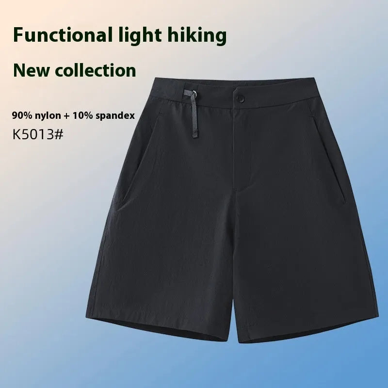 Man wearing khaki athletic shorts with four-way stretch, demonstrating movement for running or climbing.