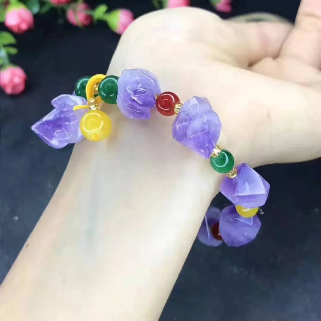 Purple natural shaped amethyst bead bracelet for women with a silver fu character charm.