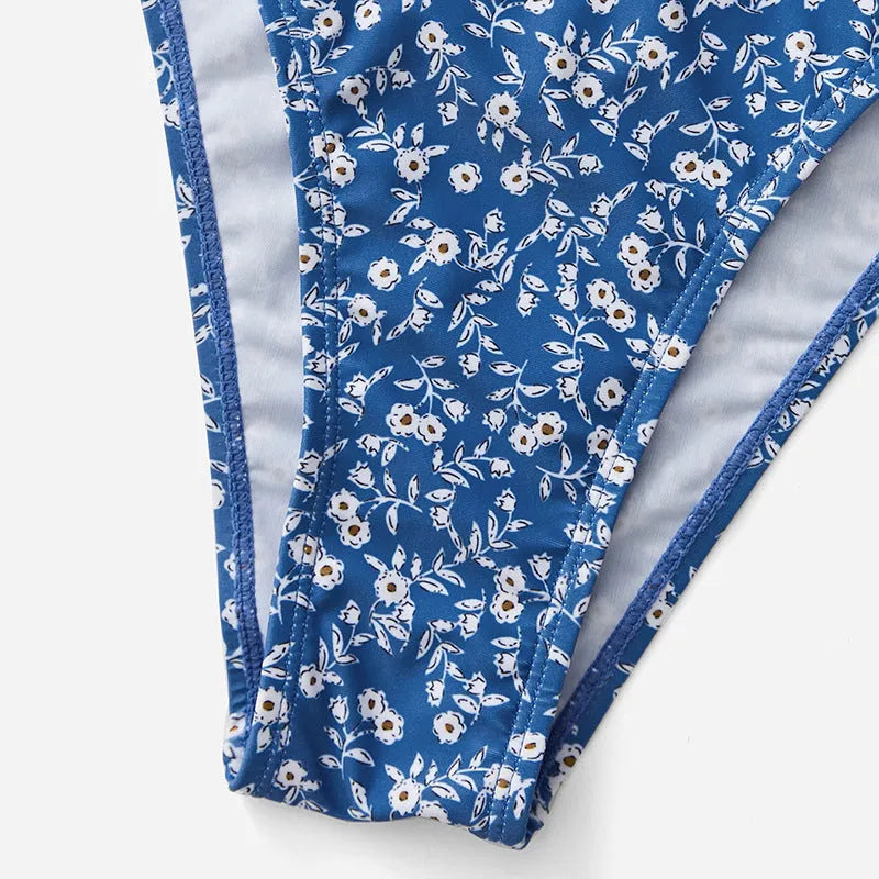 Blue polyester swimsuit three-piece set with top and shorts for swimming.