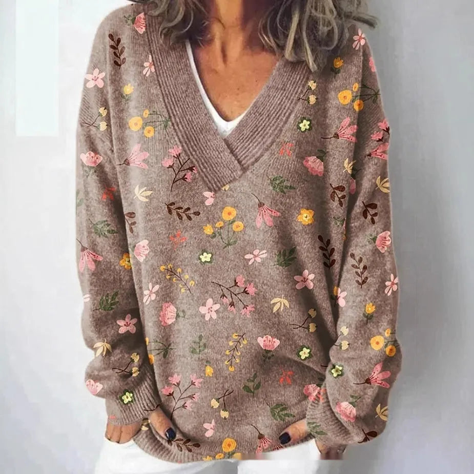Women's V-neck long sleeve sweatshirt with a textured 3D floral print pattern in a retro style.