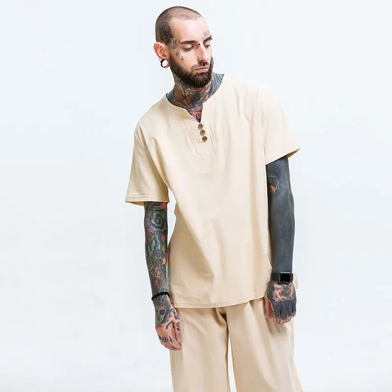 Loose grey cotton T-shirt for men on a hanger, showing short sleeves and pullover style.