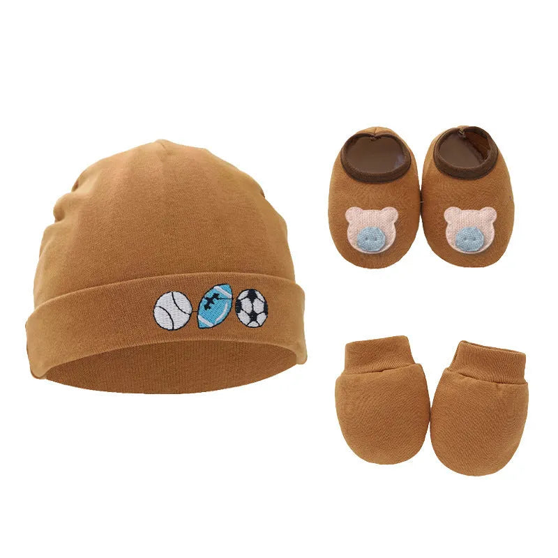 Set of white, light blue, and grey cotton baby pullover caps, gloves, and foot covers for infants.