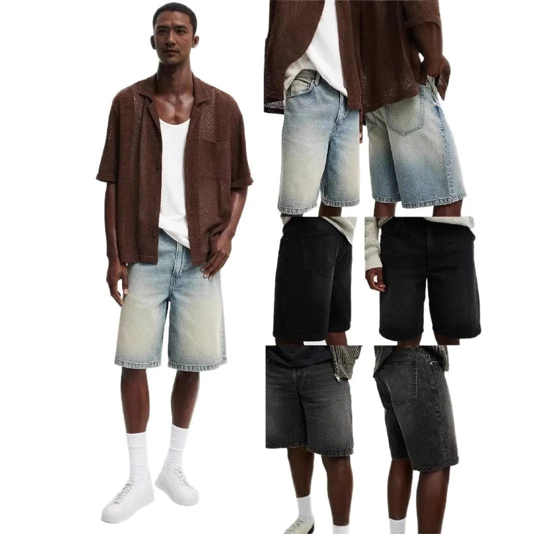 Men's loose fit light blue straight leg denim jeans on a grey background