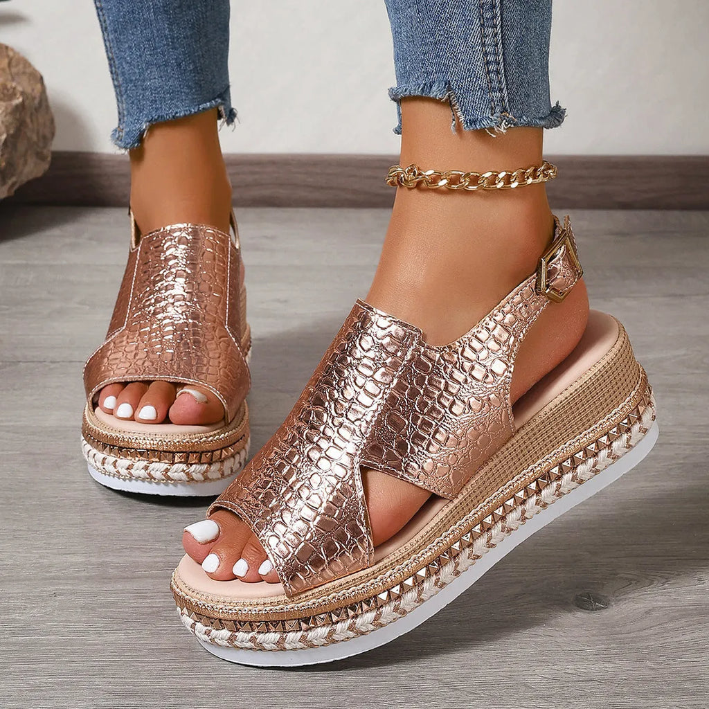 Gold women's Roman sandals with round toe and adjustable ankle buckle.