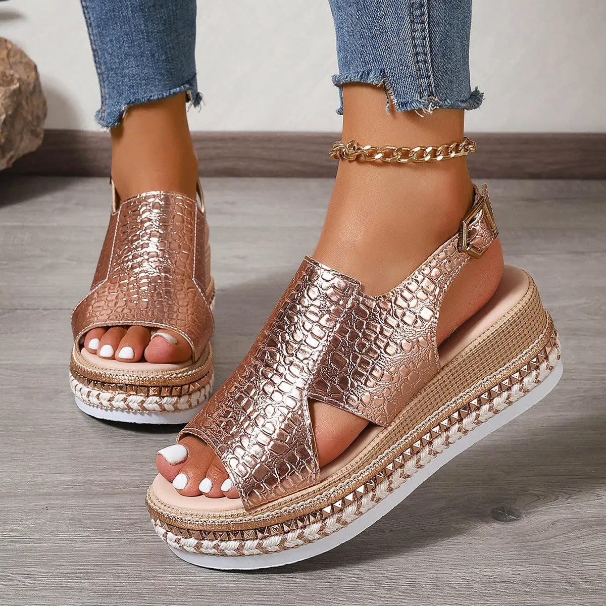 Gold women's Roman sandals with round toe and adjustable ankle buckle.