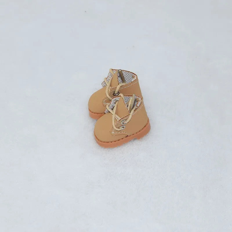 A pair of polyurethane doll shoe accessories for a 17cm figure, shown in a selected style and colour.