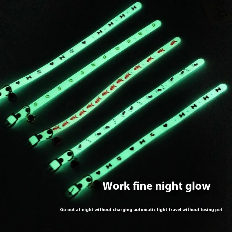 Luminous cat collar with glowing effect, silicone chain, metal bell, in a paw print pattern design.