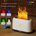 Black round ultrasonic aroma diffuser and humidifier with LED lights and remote control on a table.