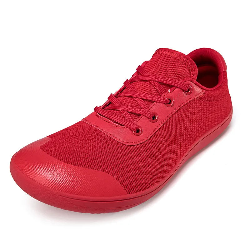 Men's solid-colour training shoes with a mesh upper, wide fit, and ribbed non-slip sole.