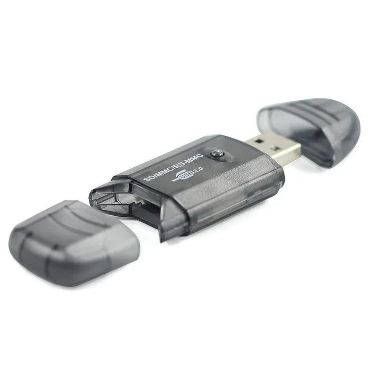 Transparent plastic USB card reader with LED light option on a desk next to memory cards.