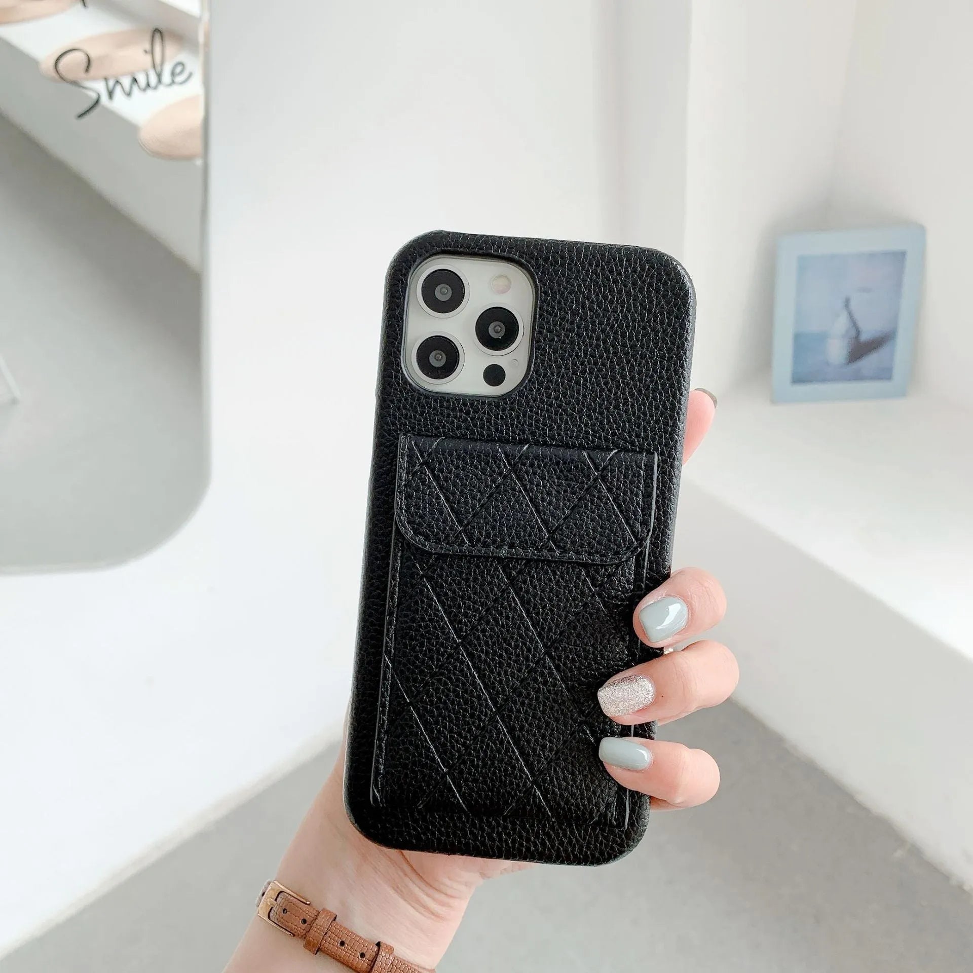 Tide Brand black imitation leather phone case with card slot for iPhone 12 Pro Max.