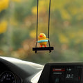 Yellow plastic duck car hanging ornament in four cartoon design styles.