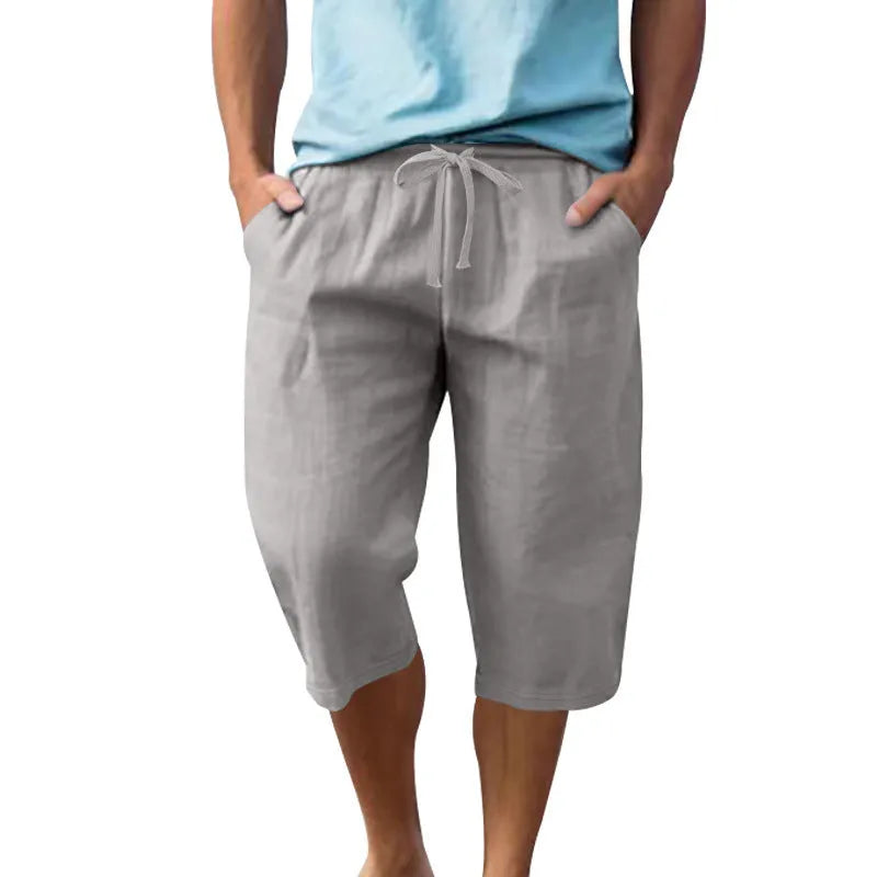 Men's solid colour linen shorts with a drawstring waistband in a light blue shade