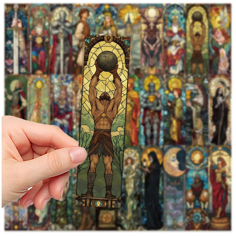Set of 30 colourful painted glass tarot design paper bookmarks laid out flat.