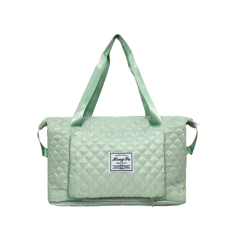Foldable Oxford cloth travel duffle bag in solid colour with rhombus sewing design and shoulder strap