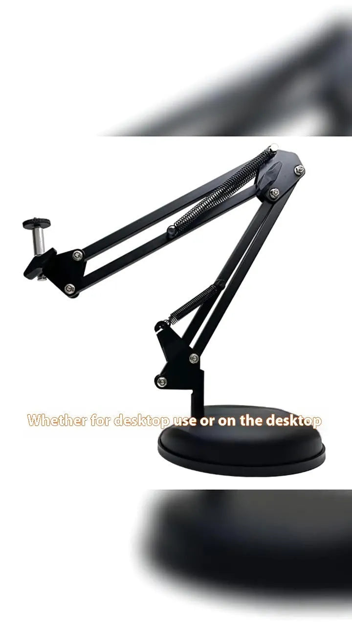 Black foldable metal desktop cantilever bracket holding a tablet, showing its adjustable arm and clip.
