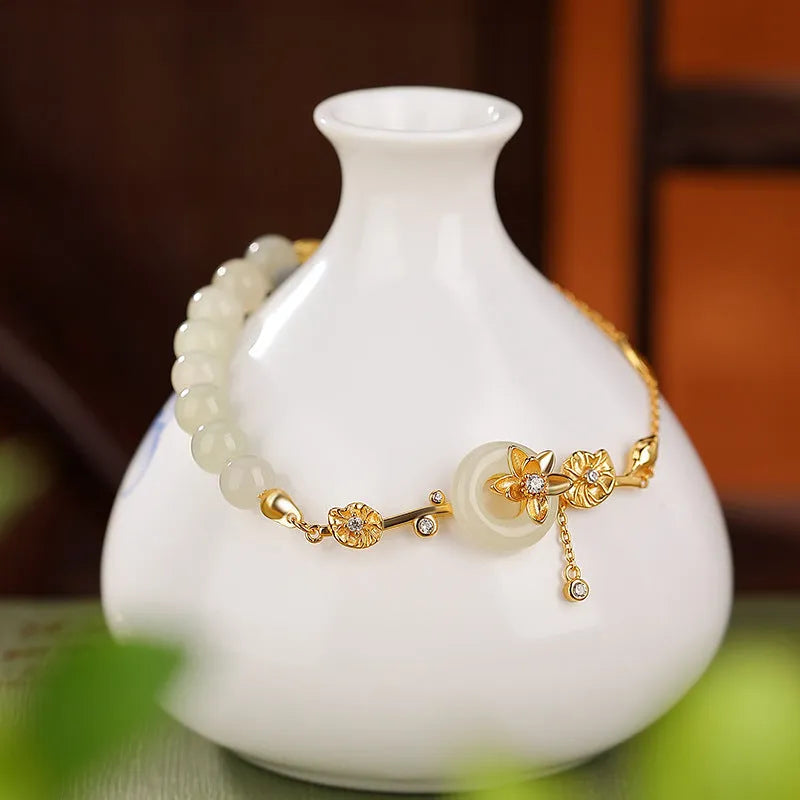 Women's retro bracelet with Hetian jade lotus peace buckle design in 925 silver