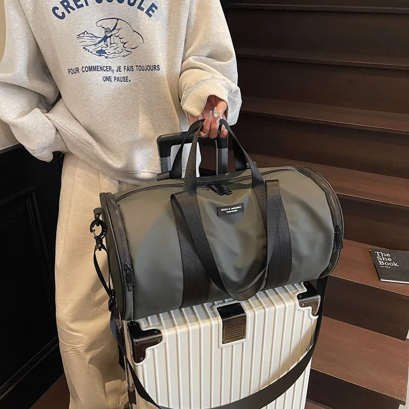 Waterproof Oxford cloth travel bag for sports and leisure in black, dark gold, and dark grey colours