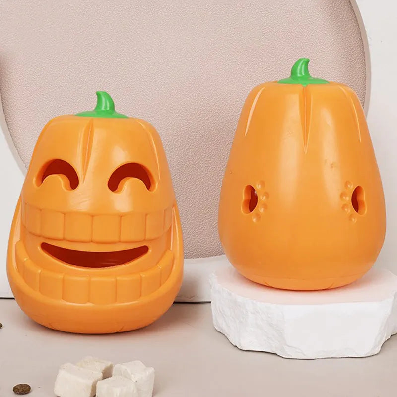 Orange Halloween pumpkin shaped dog chew toy with a black treat-dispensing funnel on top.