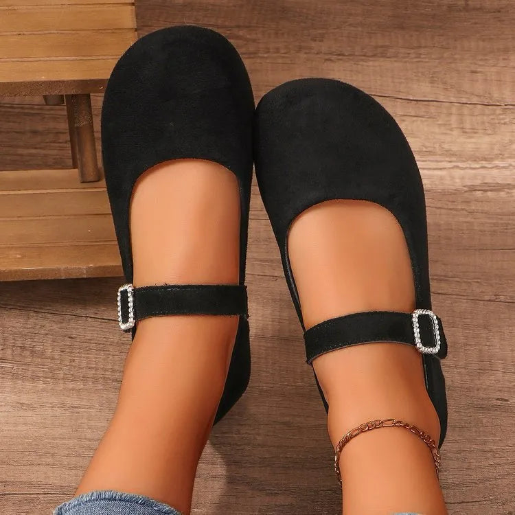 Women's solid black low-top canvas fisherman shoes with a flat rubber sole.